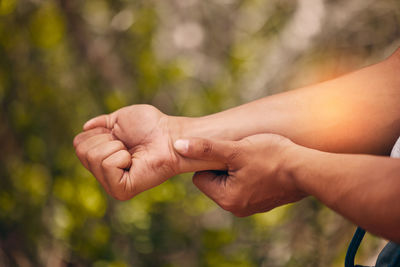 Cropped hand of man holding hands