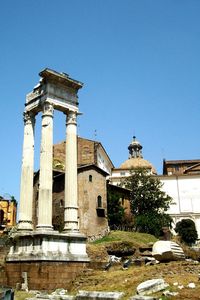 Low angle view of historical building against clear blue sky