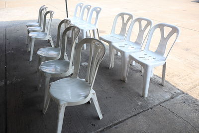 High angle view of empty chairs and tables in restaurant