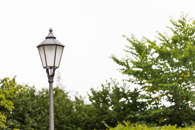 Low angle view of street light against sky