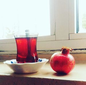 Close-up of red fruit on table