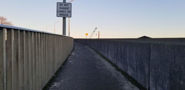 Road sign against clear sky