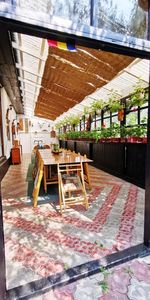 Empty chairs and tables in restaurant