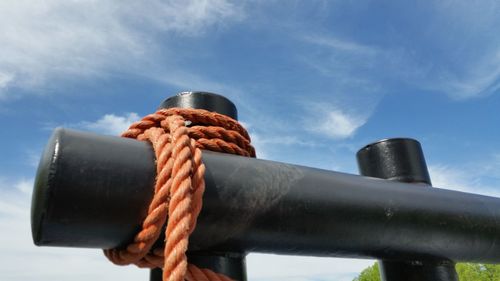 Low angle view of rope tied to cleat