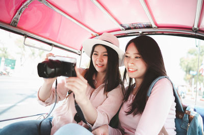 Young woman sitting in bus