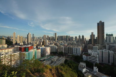 High angle view of modern buildings in city against sky