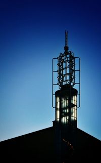 Low angle view of built structure against clear blue sky