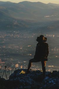 Full length of woman on top of the mountain