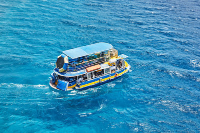 High angle view of ship sailing in sea