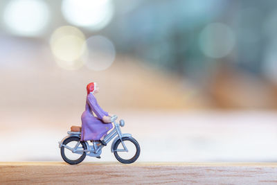 Close-up of toy bicycle on table