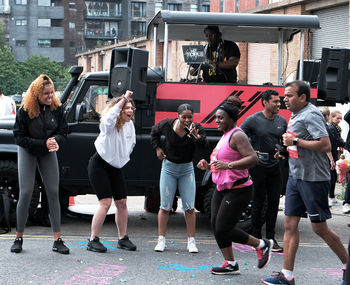 Group of people photographing in city