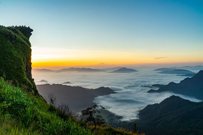 Scenic view of mountains against sky during sunset