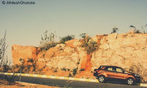 Car on road against clear sky