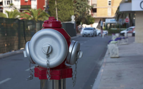 Close-up of fire hydrant on road in city