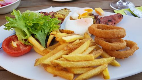 Close-up of burger and fries on table