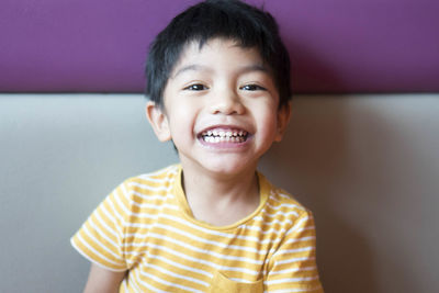 Portrait of smiling boy at home