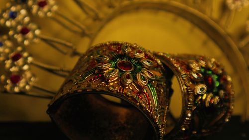 Close-up of buddha statue on table