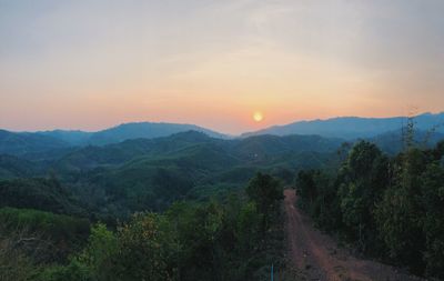 Scenic view of mountains against sky during sunset
