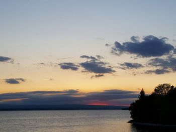 Scenic view of sea against sky at sunset