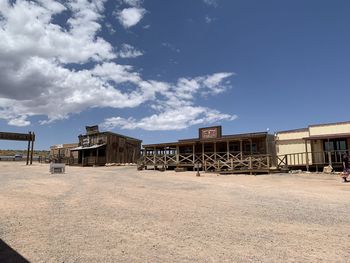 Built structures on field against sky