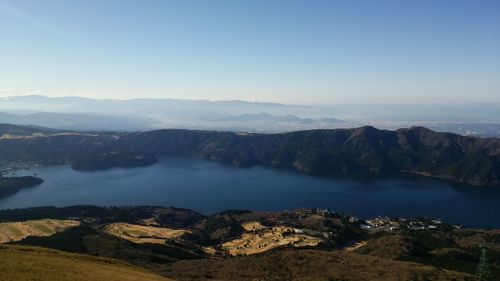 Scenic view of lake and mountains against sky