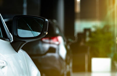 Close-up of reflection on side-view mirror