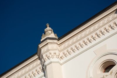 Low angle view of historical building against clear blue sky