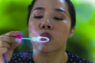 Close-up portrait of a woman with bubbles