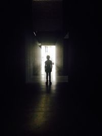 Woman walking in tunnel