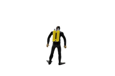 Full length rear view of man standing against white background