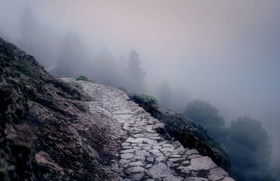 Clouds pass over roque nublo near tejeda, gran canaria, spain.