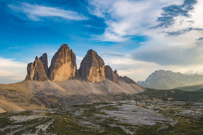 Rock formations on landscape against sky