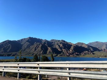 Scenic view of mountains against clear blue sky