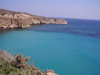 Scenic view of sea against clear blue sky