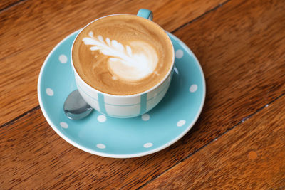 High angle view of cappuccino on table