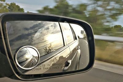 Cropped image of car on road