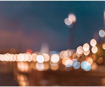 Defocused image of illuminated city at night