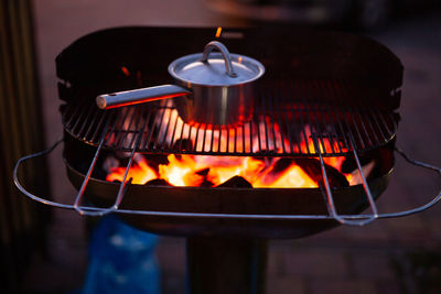 Close-up of burning candles on barbecue grill