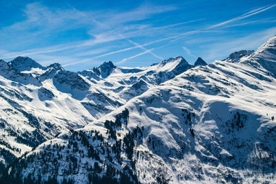 Scenic view of snowcapped mountains against sky