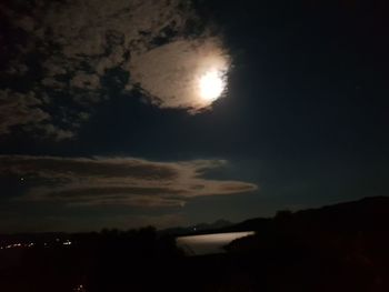 Low angle view of silhouette moon at night