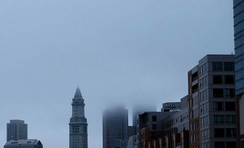 Low angle view of modern buildings against clear sky