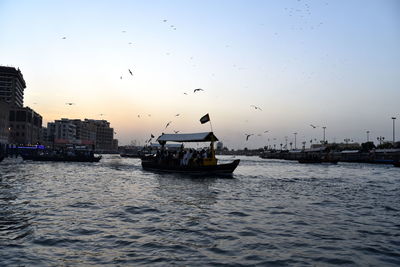 Dubai skyline from dubai creek harbour and dubai canal to downtown and business bay, uae