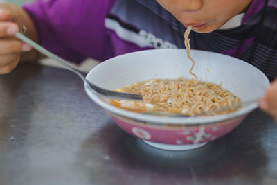 Close-up of woman holding ice cream in bowl