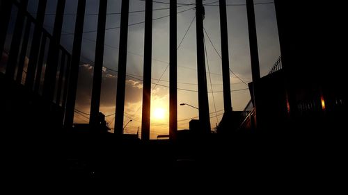 Silhouette of city at sunset