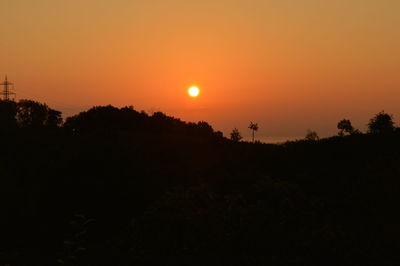 Scenic view of silhouette landscape against sky during sunset