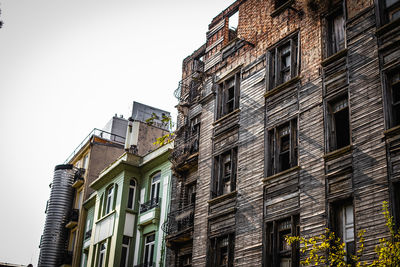 Low angle view of residential building against clear sky