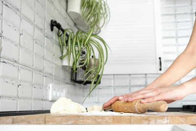 Midsection of person preparing food at home