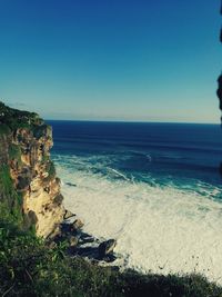 Scenic view of sea against clear blue sky