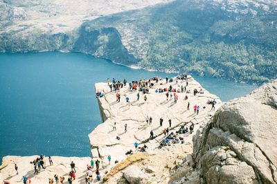 High angle view of people overlooking calm lake