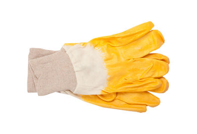 Close-up of clothes drying against white background